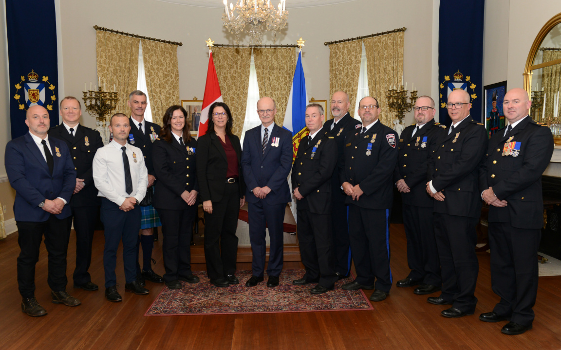 Recipients of the Emergency Medical Services Exemplary Service Medal pose for a photo at Government House