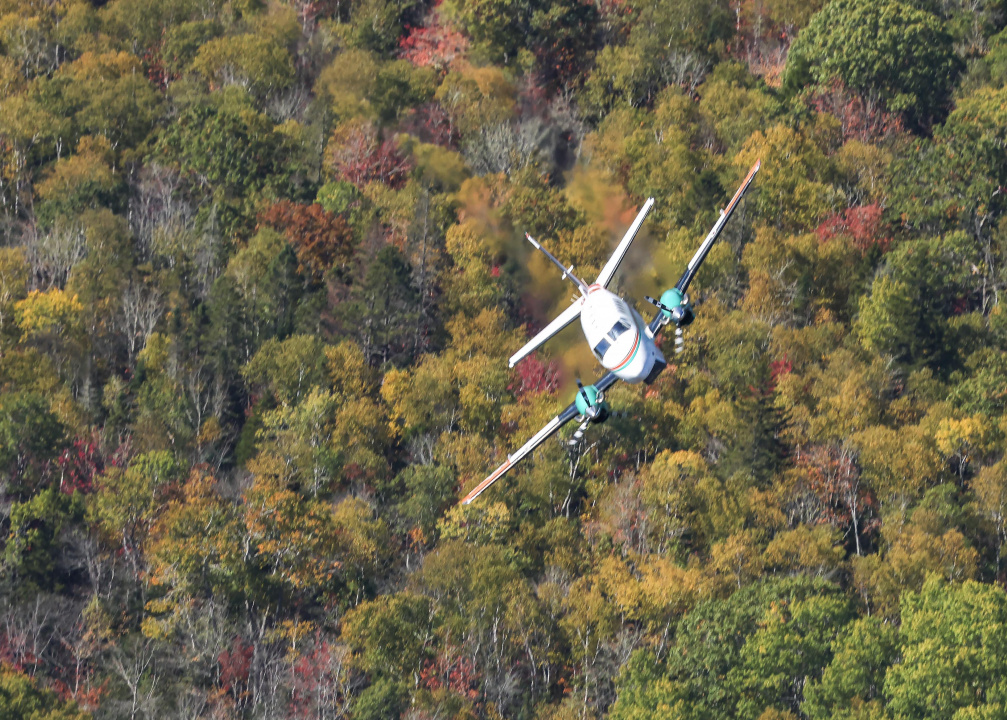Aerial photo of a plane over the Lake George wildfire
