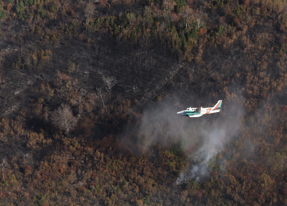 Aerial photo of a plane over the Lake George wildfire