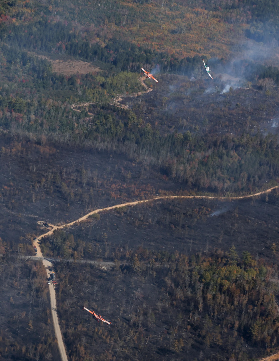 Aerial photo of two planes over the Lake George wildfire