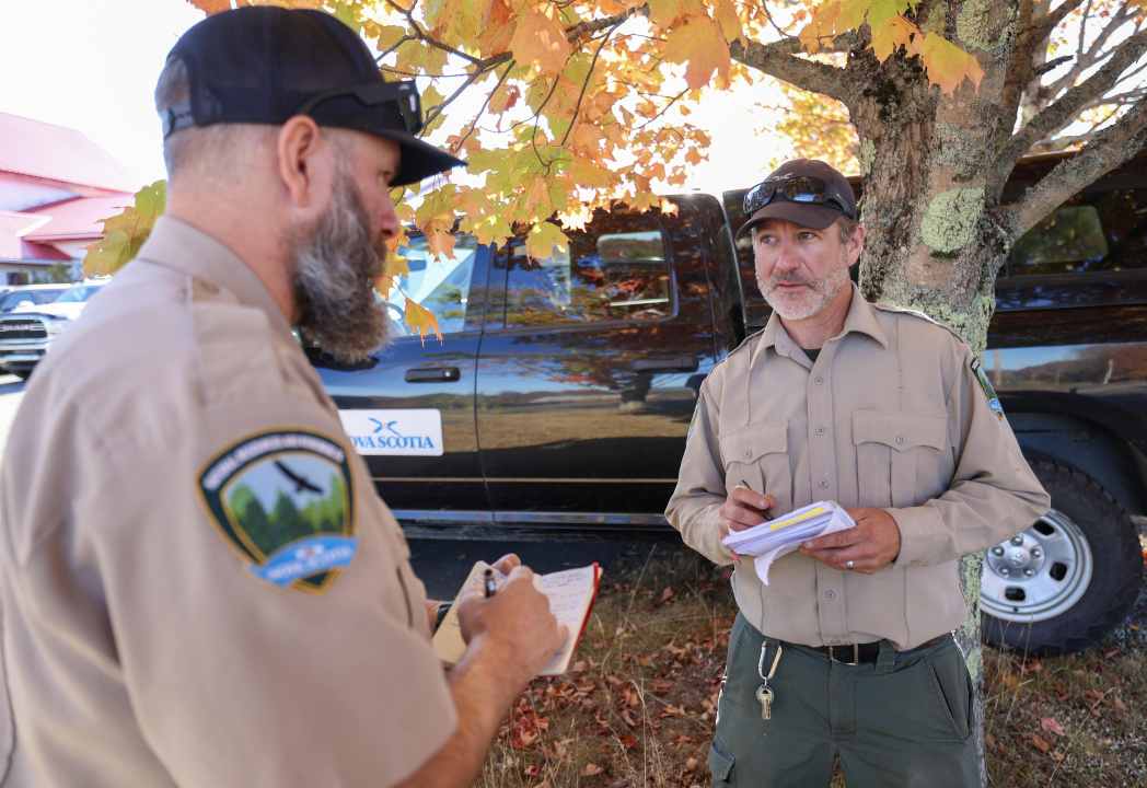 Nathan Pick, Logistics Section Chief, and Greg Arthur, Deputy Logistics Chief, go over last minute details before heading out for the day from the Morristown Community Centre.