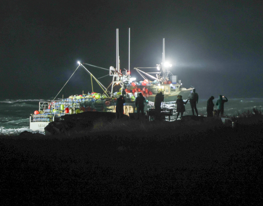 Spectators braved the rainy morning to see part of Nova Scotia’s  lobster fleet leaves Yarmouth Harbour 