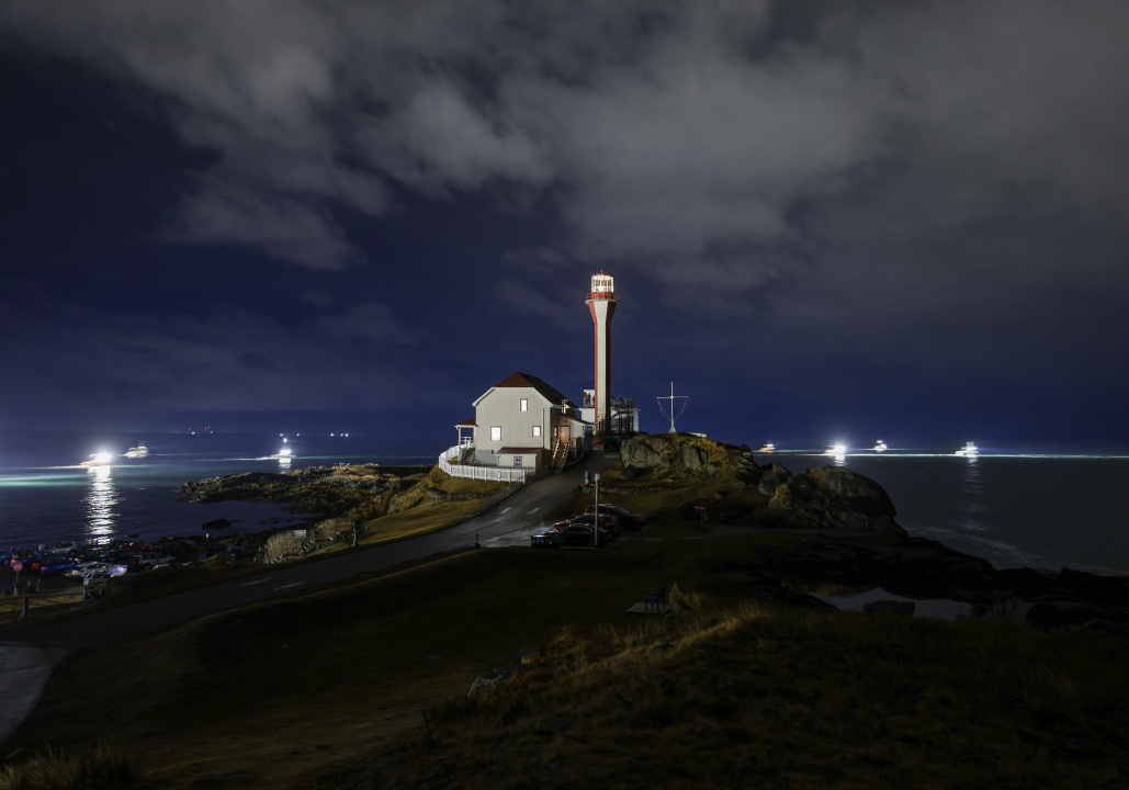 Lobster boats round Cape Forchu at 5:00 am on Monday Nov 24 for the opening on Lobster season in LFA 34
