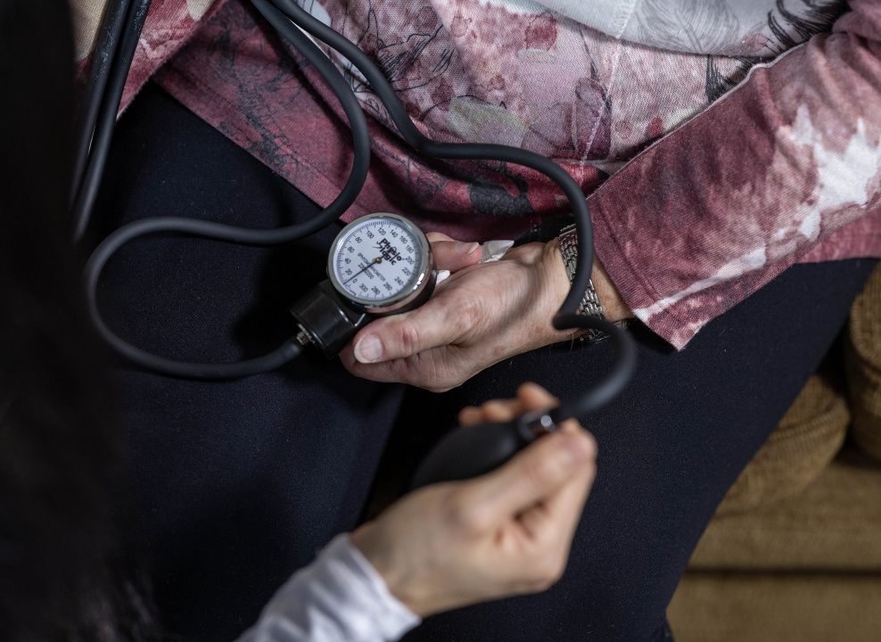 Close-up of someone taking a senior's blood pressure