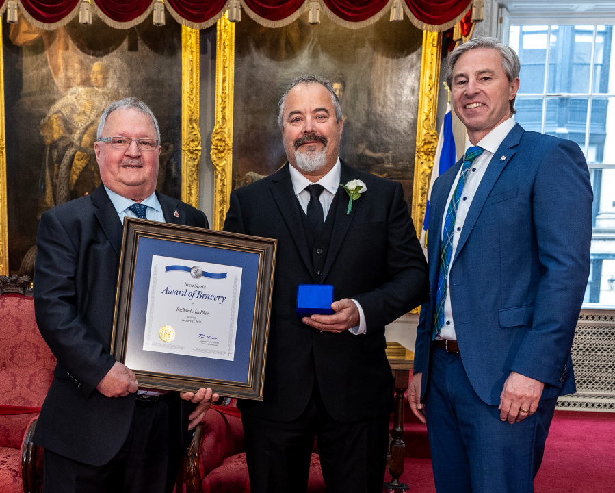 L-R: Tom Steele, Chair, Medal of Bravery Advisory Committee; medal recipient Richard MacPhee of Boularderie; and Premier Tim Houston