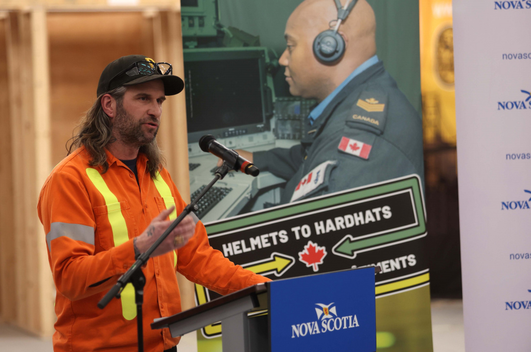 Dave Thimot, Royal Canadian Navy veteran and Red Seal electrician, at a podium