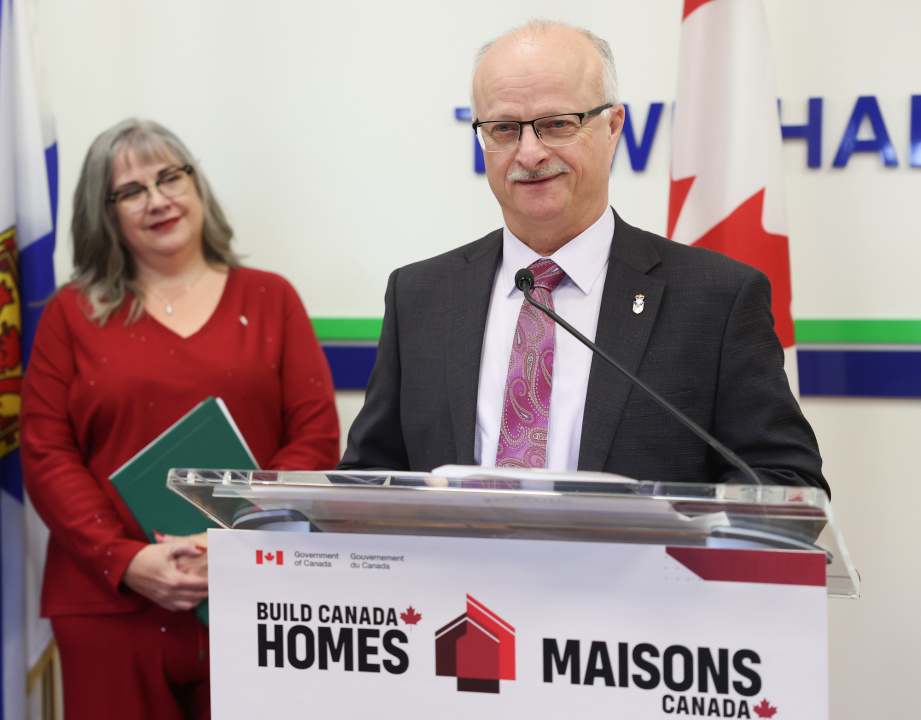 Housing Minister John White at a podium