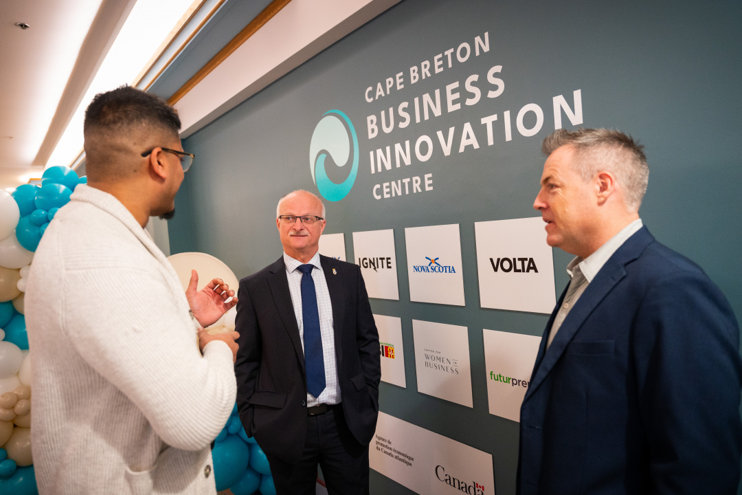 Housing Minister John White and two other people at the official opening of the Cape Breton Business Innovation Centre