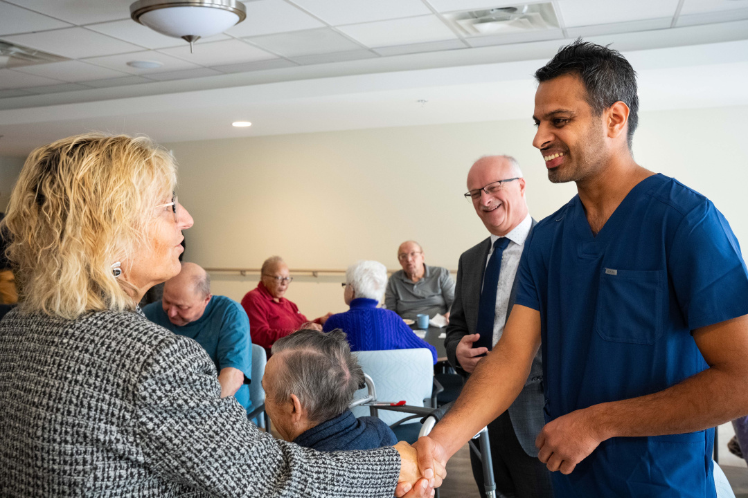 Barbara Adams, Minister of Seniors and Long-Term Care congratulates recently graduated continuing care assistant Bhawanjot Sidhu, who works at the new Carefield Manor.