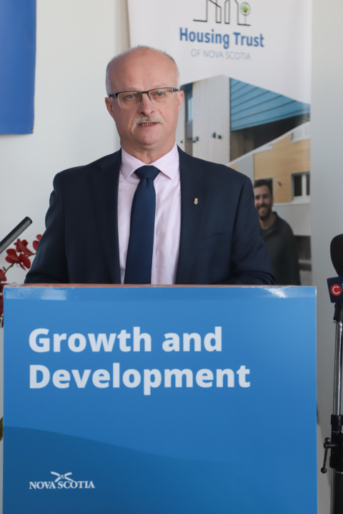 Housing Minister John White at a podium