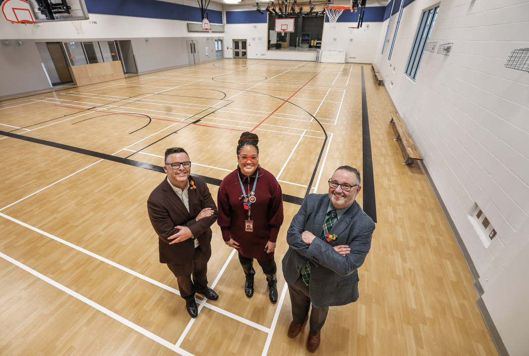 From left, Brendan Maguire, Minister of Education and Early Childhood Development; school principal Cheyanne Gorman-Tolliver; and Public Works Minister Fred Tilley in the gym at the new St. Joseph’s-Alexander McKay Elementary School.