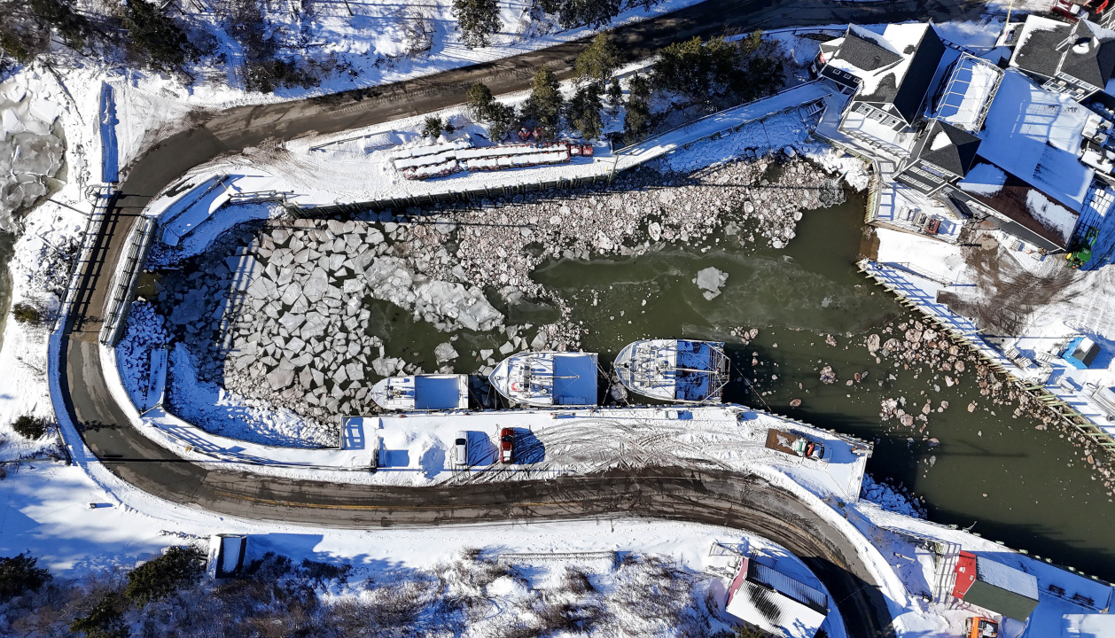 An aerial view of Halls Harbour and its shoreline.