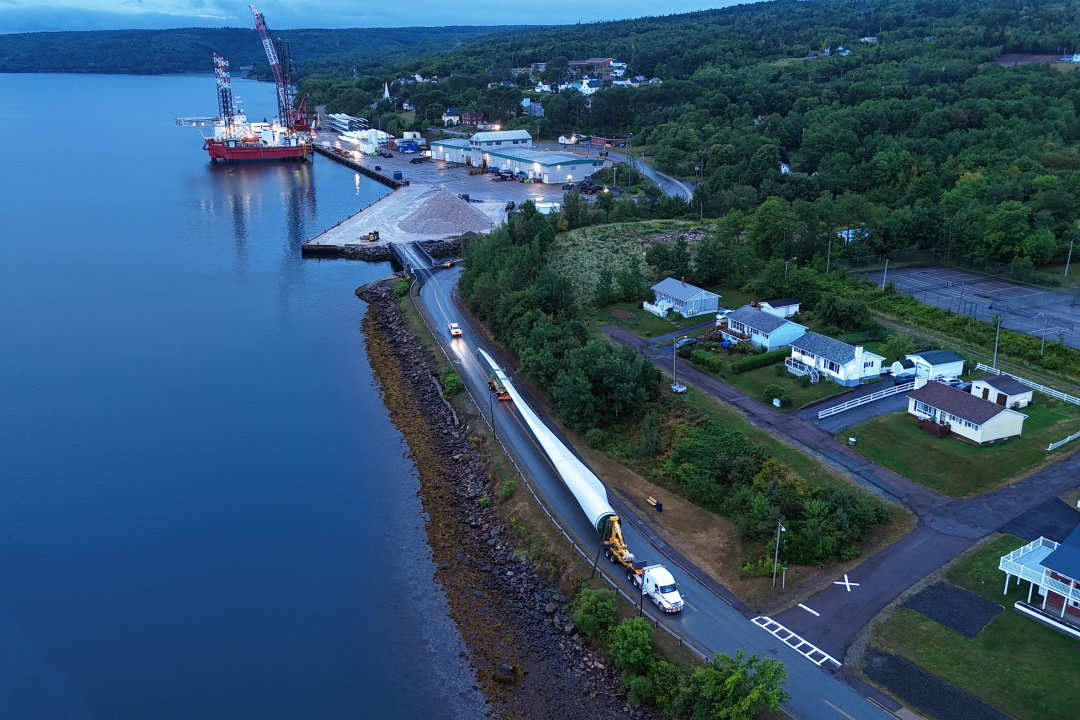 Aerial view of a wind turbine blade being transported.
