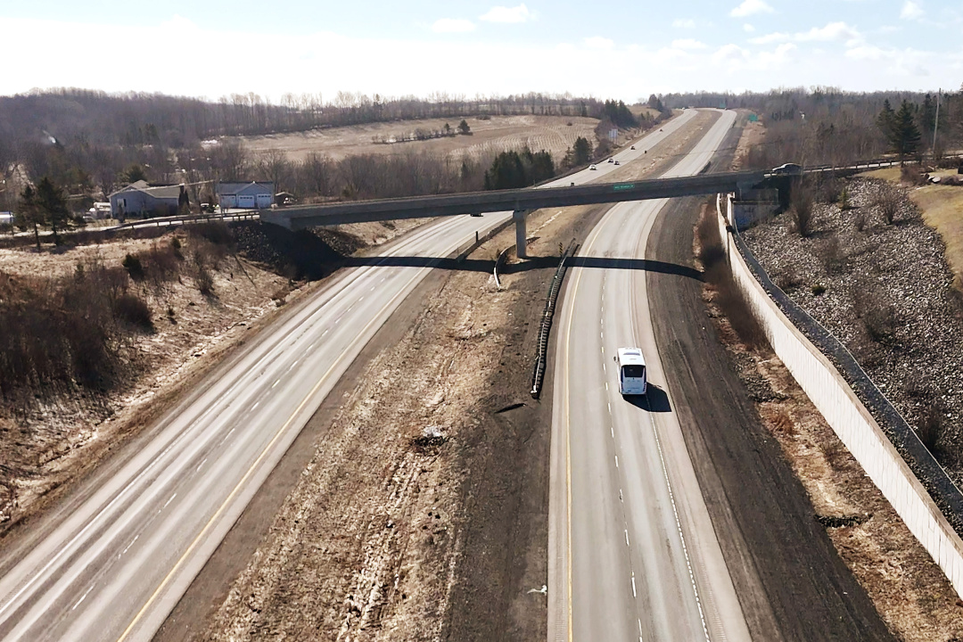 Aerial photo of a bus travelling on a highway