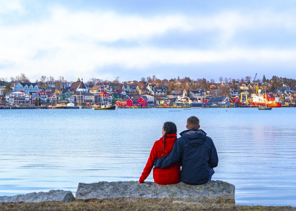 A couple looking out at Lunenburg Harbour. 