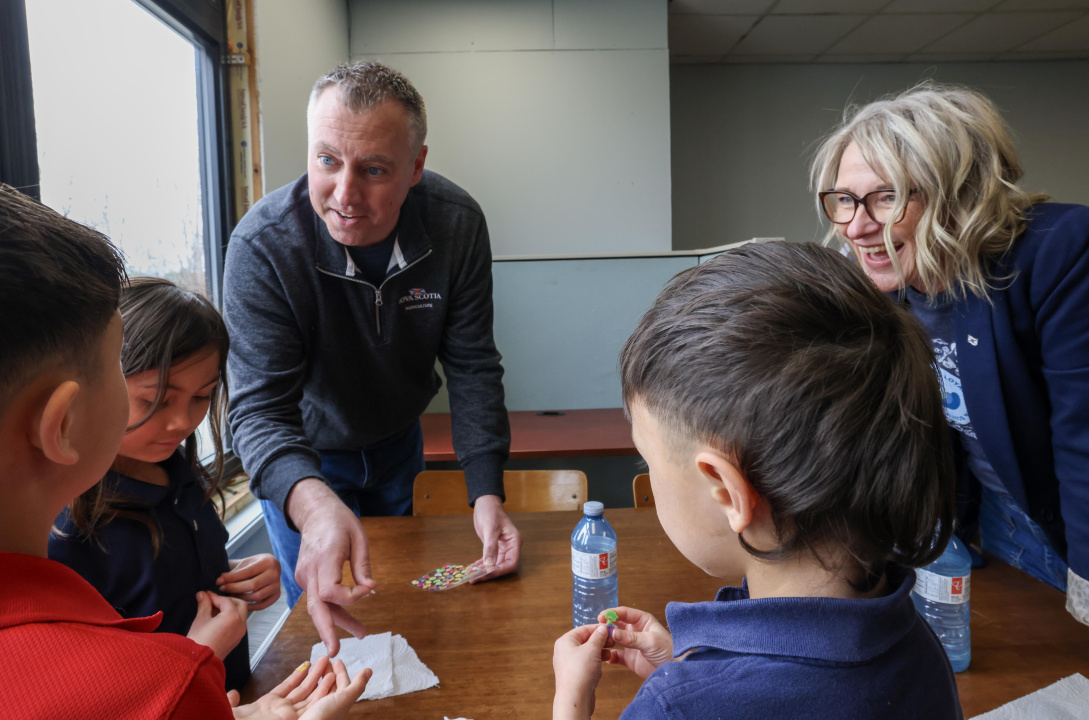 1056 Greg Morrow, Minister of Agriculture, and Melissa Sheehy-Richard, MLA for Hants West, with young students.