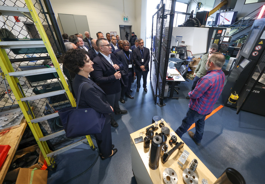 Delegates tour the space of Precise Design Engineering Solutions at COVE in Dartmouth. 