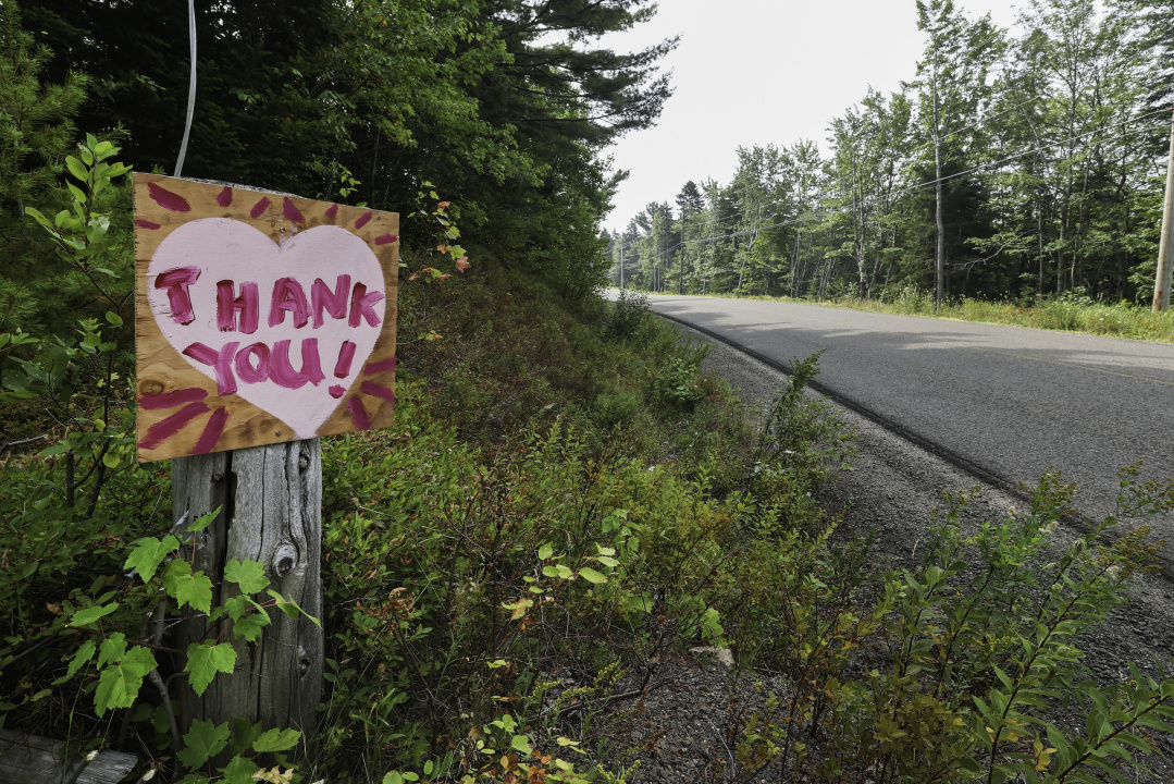 A thank-you sign alongside a road.
