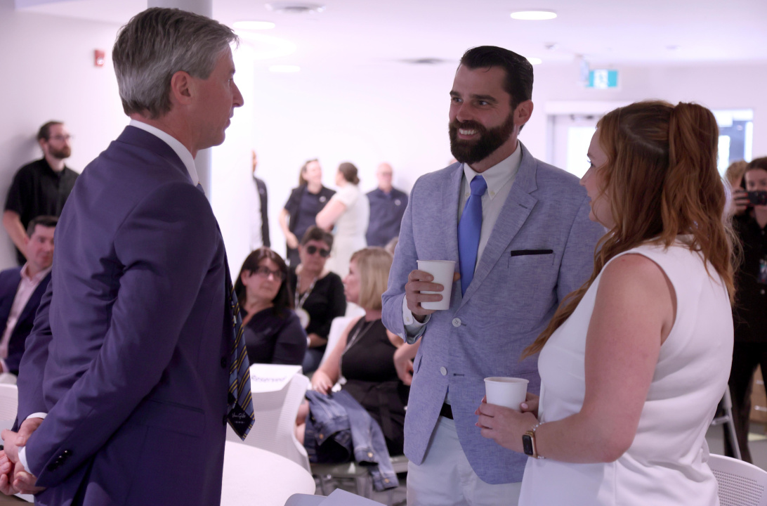 Premier Tim Houston speaks with representatives from Support Services Group Co-Operative Ltd. of Dartmouth, one of the 10 HomeShare co-ordinating organizations.