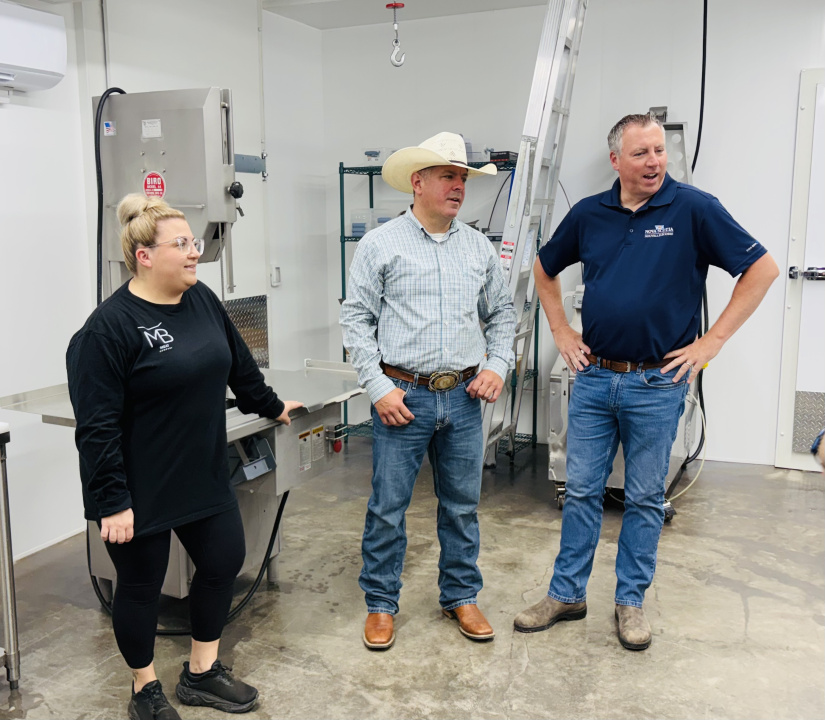 Laura McNabb, Jared McNabb and Agriculture Minister Greg Morrow at the MB Meats facility