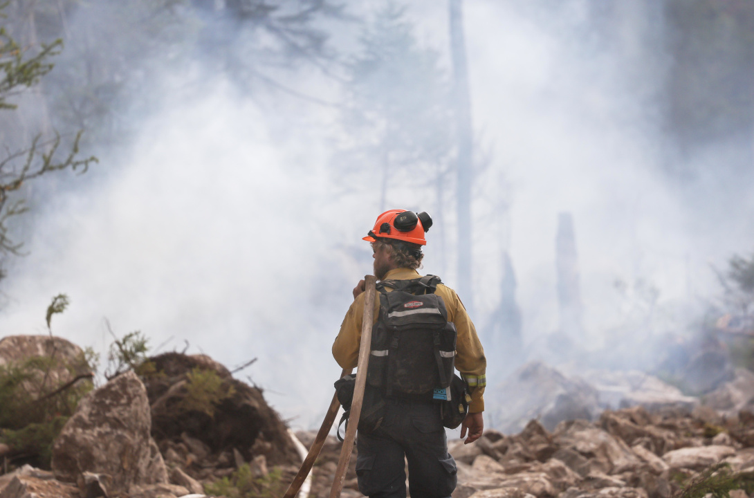 A firefighter fighting a wildfire
