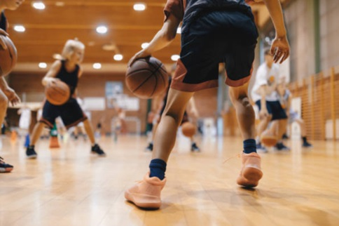 Young people playing basketball.