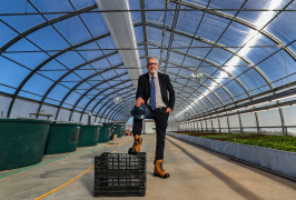 Finance and Treasury Board Minister John Lohr wearing work boots