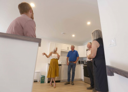 Agriculture Minister Greg Morrow in a housing unit during an announcement