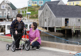 A person talking to a person with a disability