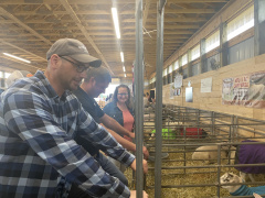 Marco MacLeod, Minister of Energy and MLA for Pictou West, and Keigan MacDonald and Elizabeth Coady, board members of the Pictou Agricultural Society