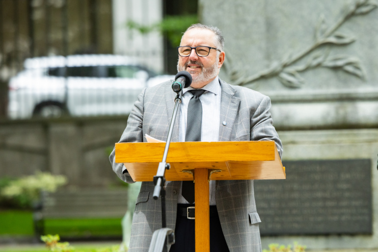 Public Works Minister Fred Tilley welcomes people to the grounds of Province House in Halifax for the 16th annual Pride flag raising.