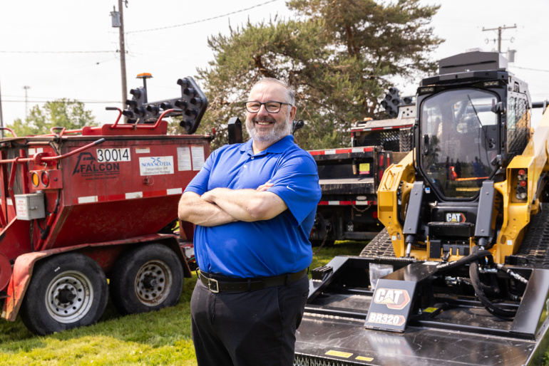 Public Works Minister Fred Tilley unveils several pieces of new road maintenance equipment.