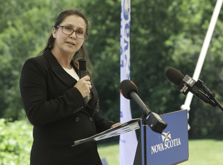 Kings South MLA Julie Vanexan at a pdium outside