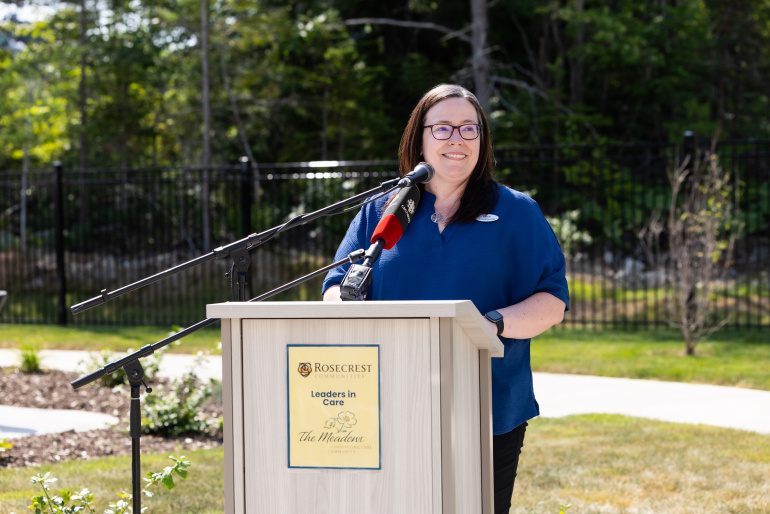 Laurie Parsons, Administrator of Rosecrest The Meadows, at a podium outside