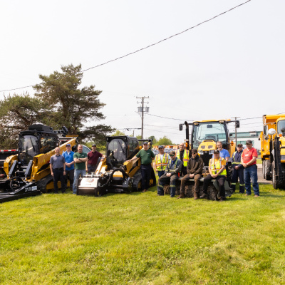 Crew members at the Public Works depot in Sydney River display new pieces of specialized maintenance equipment.