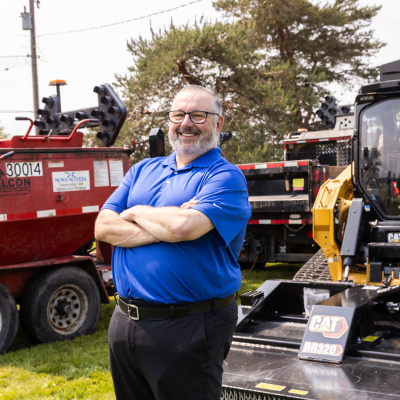 Public Works Minister Fred Tilley unveils several pieces of new road maintenance equipment.