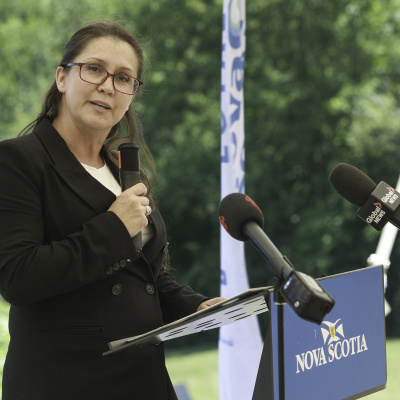 Kings South MLA Julie Vanexan at a pdium outside