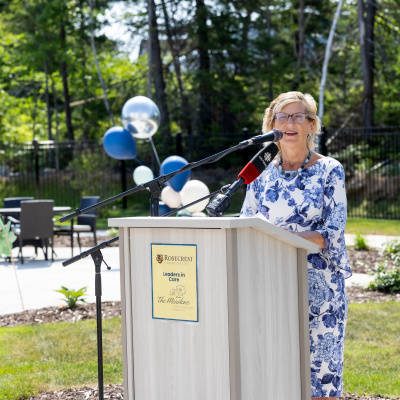 Barbara Adams, Minister of Seniors and Long-Term Care, at a podium outside